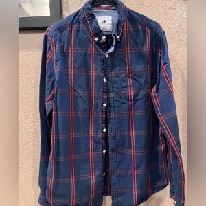 Blue long sleeved button down shirt